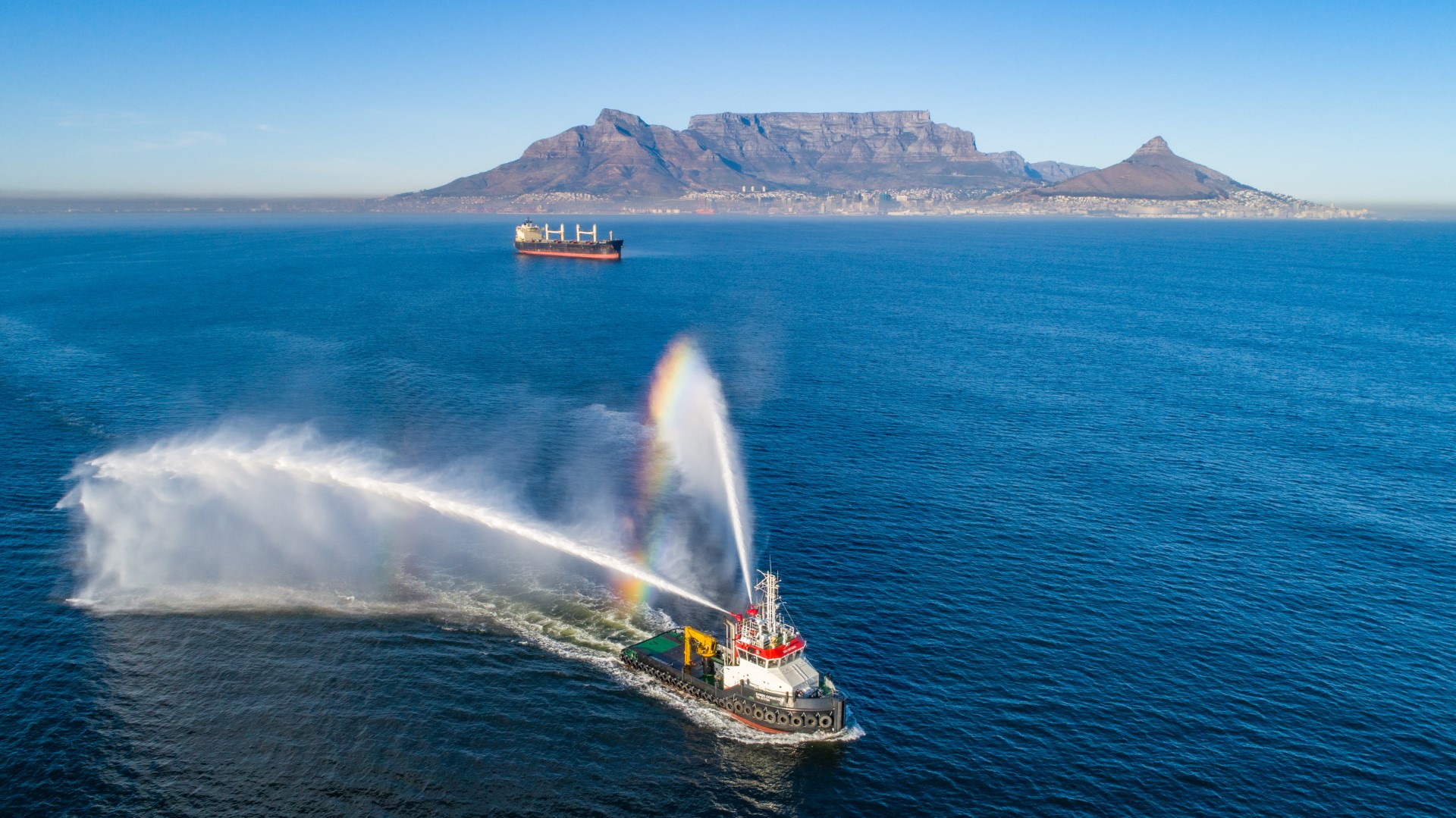 Drone image of cargo vessel docking at Cape Town harbor – aerial port inspection view